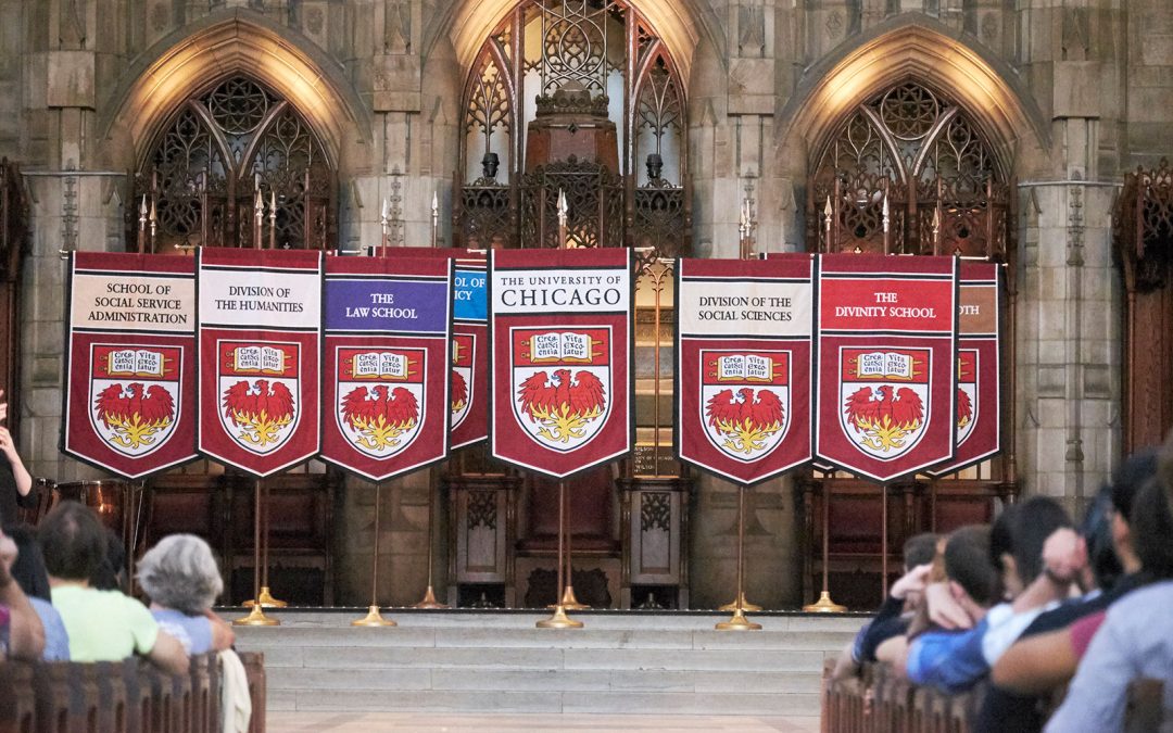 Departmental banners are displayed at Convocation in Rockefeller Chapel
