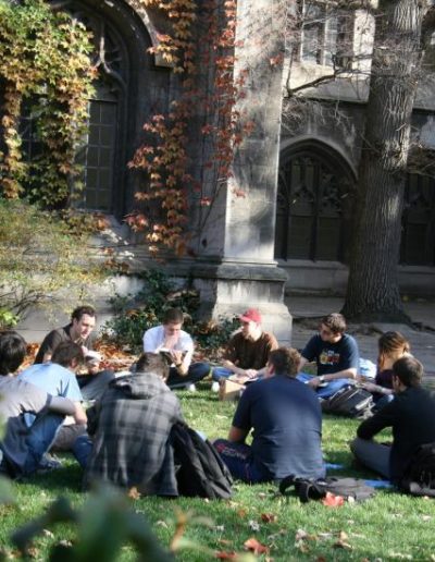 Students sitting in a circle on the quad