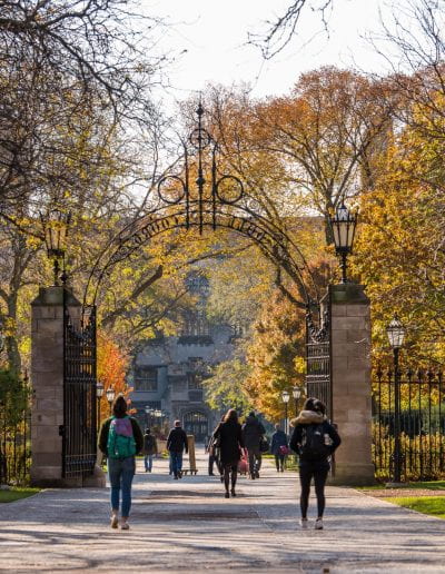 UChicago students walking across campus during autumn.